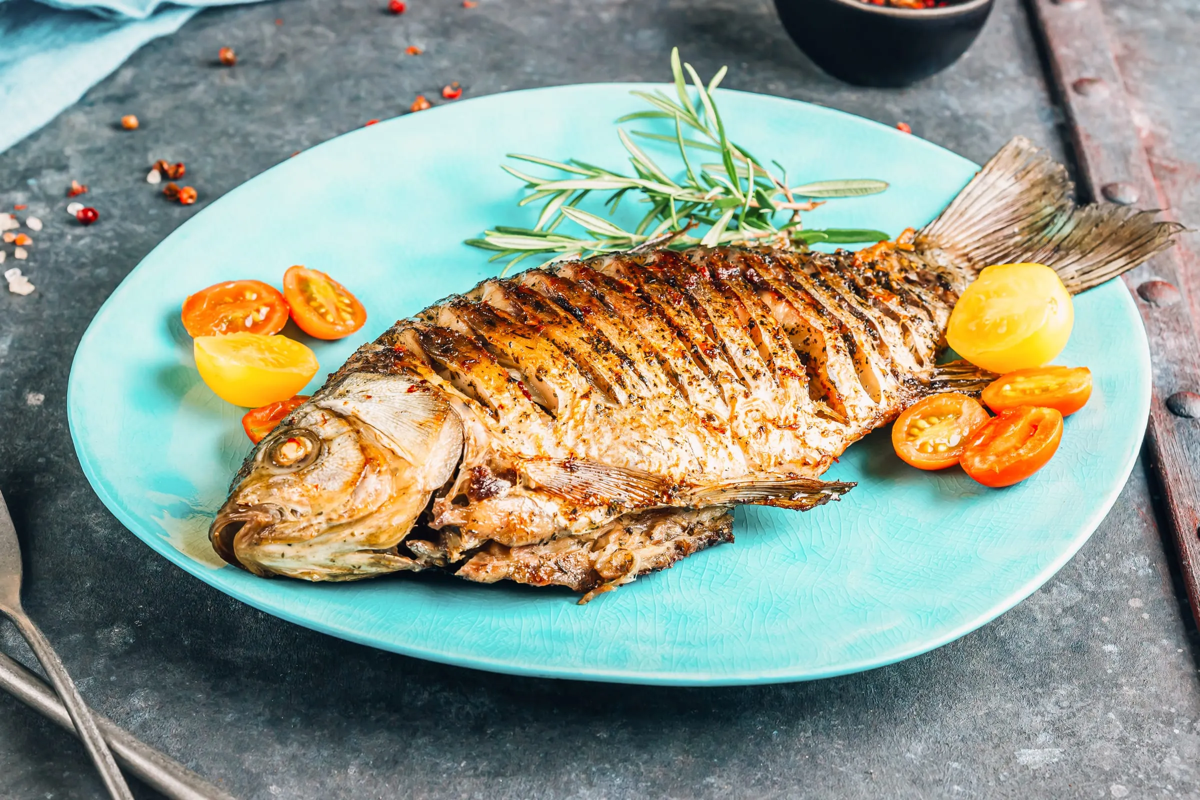 Table with fried carp and Zeta priganice